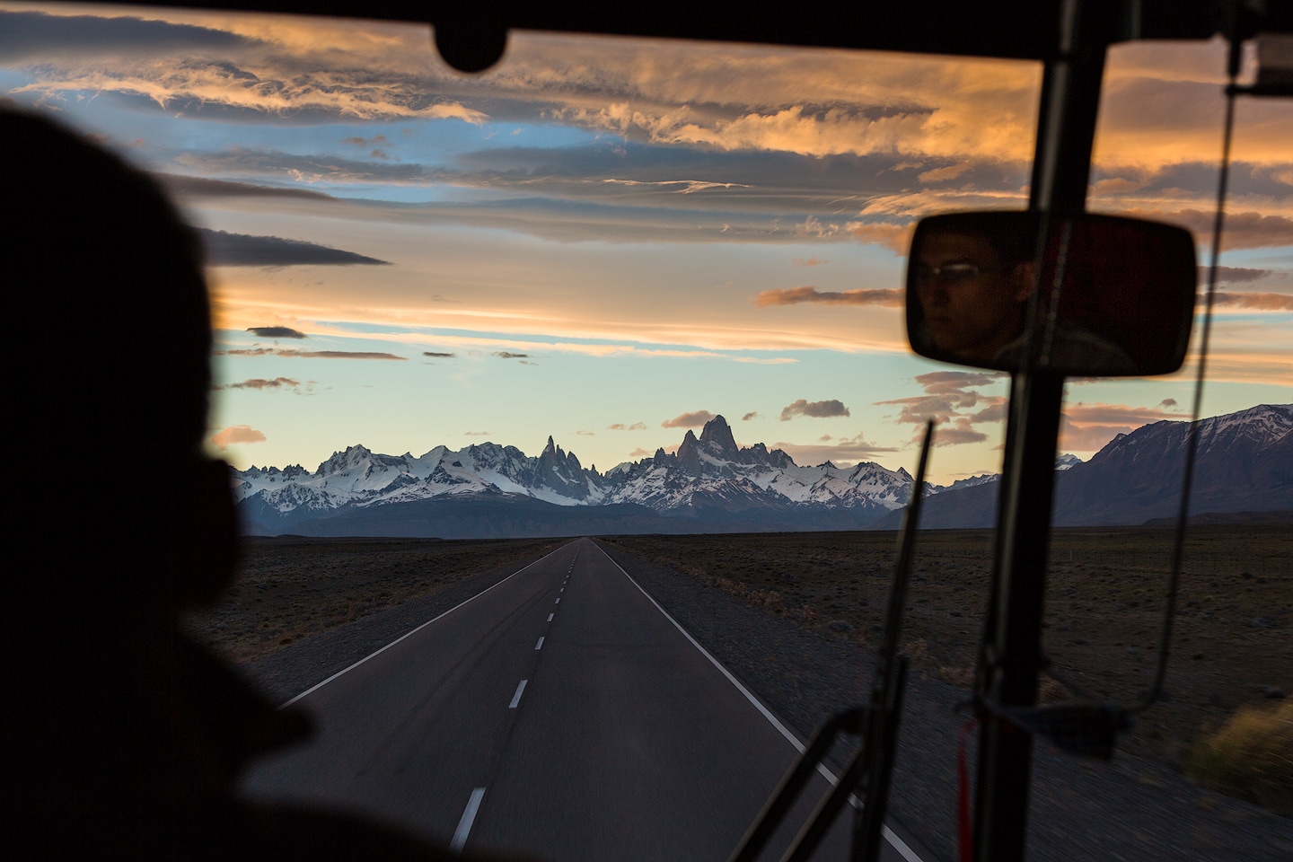 Cerro Torre and Fitz Roy seen through the Window of a bus on the road to El Chaltén.