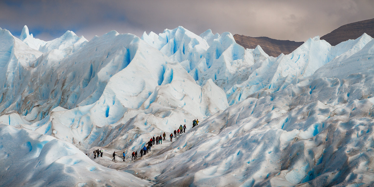 Ice trekkers walking on the surface of Perito Moreno Glacier