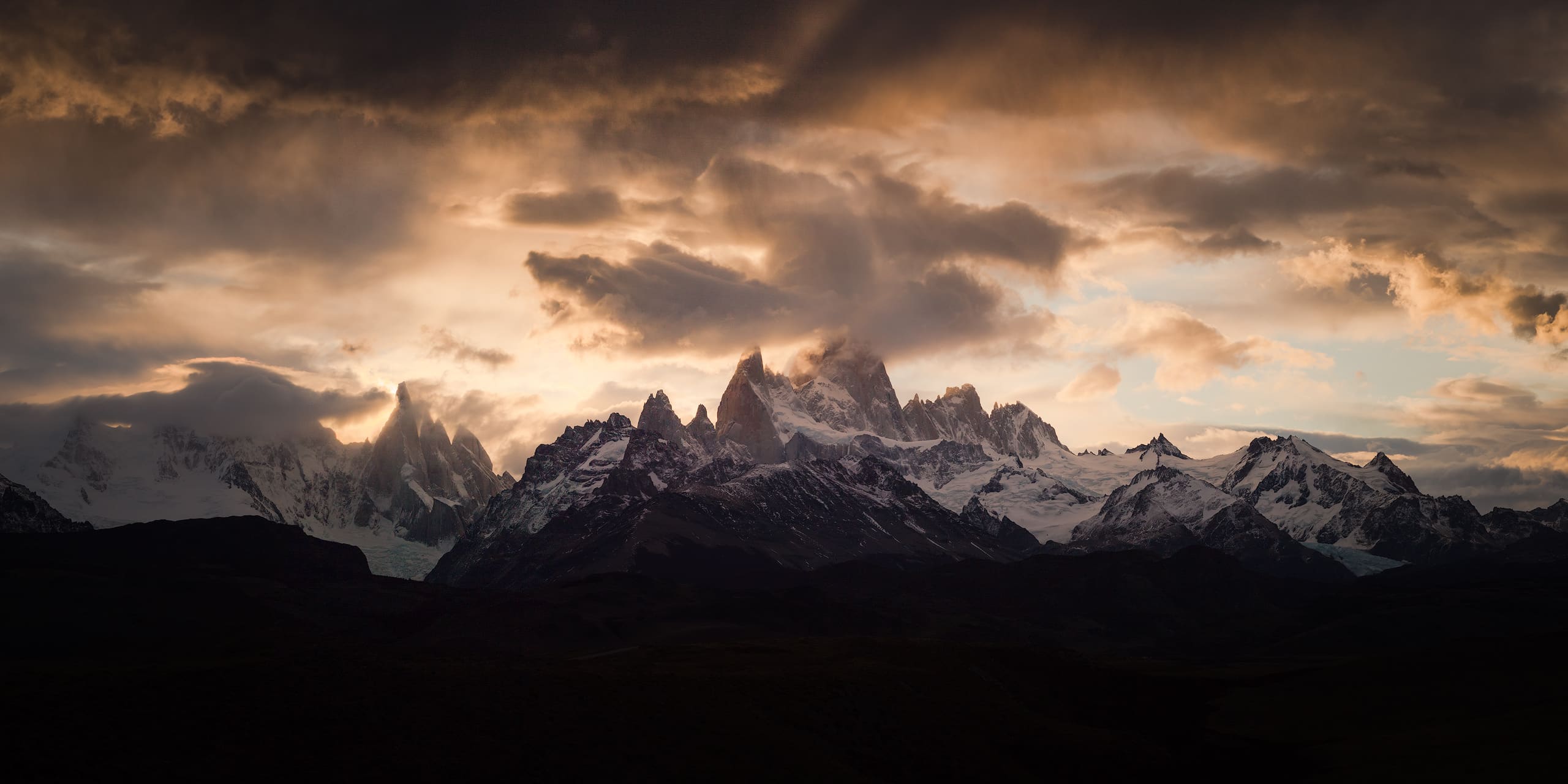 Moody panorama of Cerro Torre and Fitz Roy at sunset